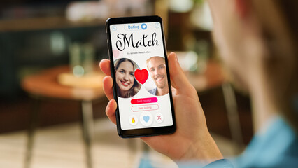 POV Dating App Concept: Person Uses Smartphone for Browsing Social Media Dating Application. Person...