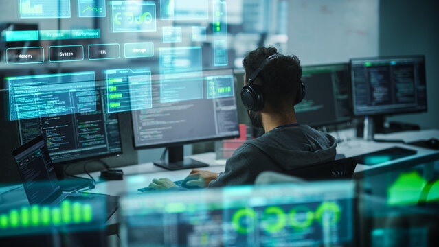 Software Programmer Working on Computer, Engineering Neural Networking, Machine Learning, Big Data, Artificial Intelligence. Edited Coding Language Projection Overlayes the Screen. Back View Shot - Powered by Adobe