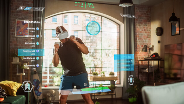 Man Using Virtual Reality Headset in Metaverse for Boxing in Video Game. Person Fights AI, Scoring Points, Virtual Training, Fitness, Exercise, Online Workout. 3D Graphics, Augmented Reality Edit.