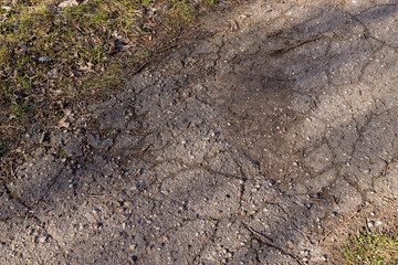 damaged and broken asphalt highway, close-up
