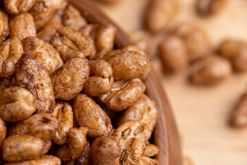 Grain wheat covered with a thin layer of chocolate