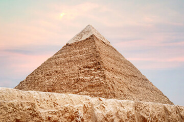 Fototapeta na wymiar stone wall in front of the great pyramid of Chephren. Great pyramids of ancient Egypt in Giza, Cairo