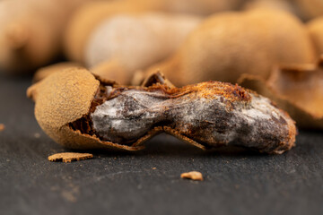 open ripe tamarind pods with edible pulp