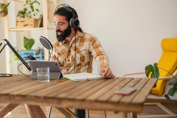 man work at home content creator radio podcast blogging