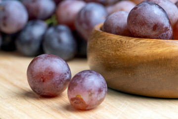 Harvested blue grapes on the table