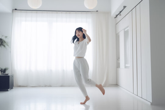 A serene Japanese woman with flowing hair and smooth skin basks in the light of a sun-drenched room, exuding an air of calm and relaxation. generative AI.