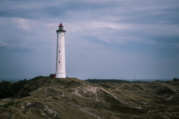 Lighthouse Lyngvig Fyr at danish west coast in spring. High quality photo - obrazy, fototapety, plakaty