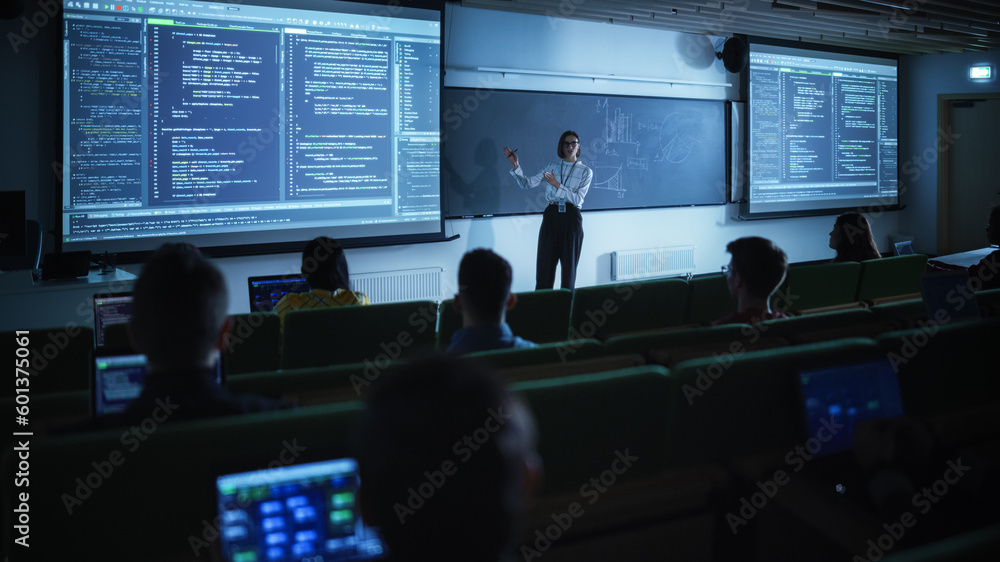Leinwandbilder Young University Professor Explaining the Importance of Artificial Intelligence to a Group of Diverse Students in a Dark Auditorium. Female Teacher Showing Big Data Ecosystem on Two Big Screens