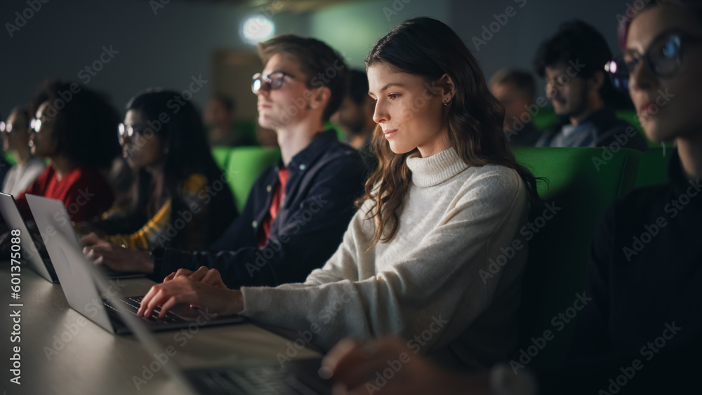 Aufkleber Beautiful Smart Female Student Studying in University with Diverse Multiethnic Classmates. She is Using a Laptop Computer. Applying Her Knowledge to Acquire Academic Skills in Class