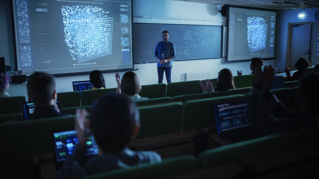 Diverse Multicultural Students Studying in University Room, Listening to a Young Multiethnic Professor Explaining Big Data and Artificial Intelligence Research Project. Computer Science Education