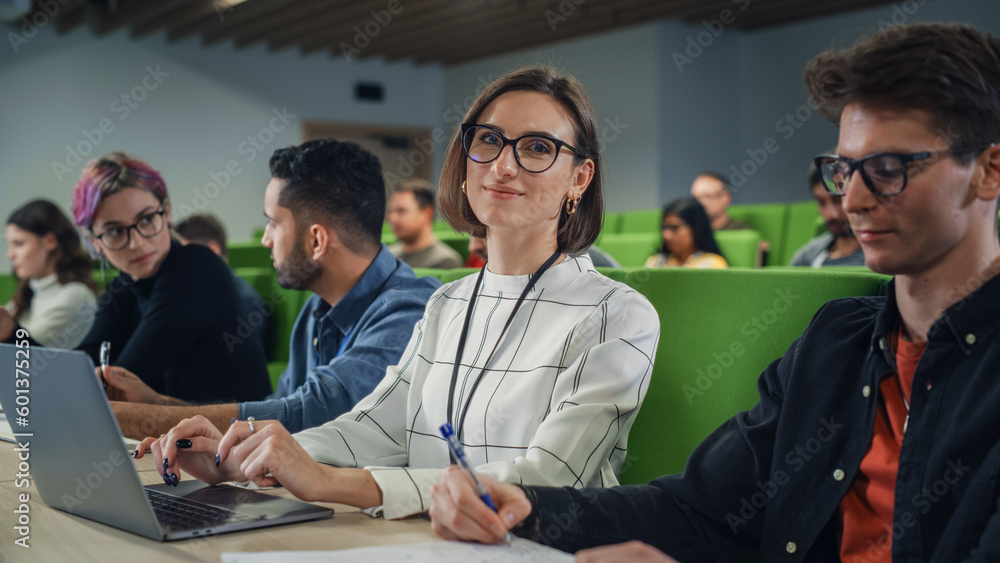 Fototapete portrait of a happy young caucasian female in glasses looking at camera and smiling. young female st