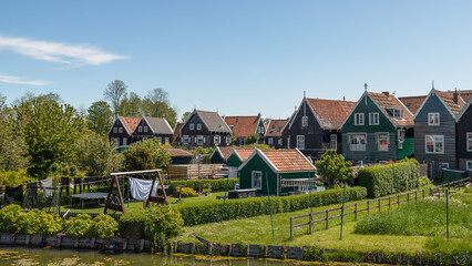 Dutch village of Marken with colorful wooden houses on the peninsula on the Markermeer.