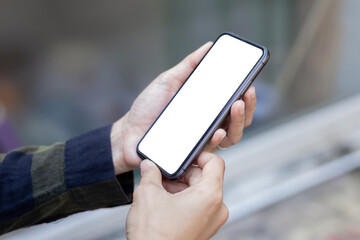 cell phone blank white screen mockup.hand holding texting using mobile on desk at office.background empty space for advertise.work people contact marketing business,technology
