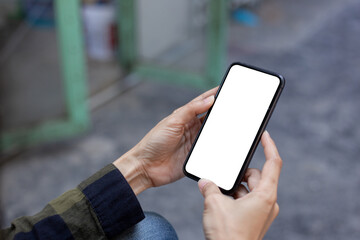 cell phone blank white screen mockup.hand holding texting using mobile on desk at office.background empty space for advertise.work people contact marketing business,technology