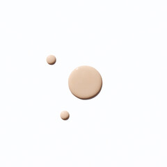 Liquid foundation smudge on white background. Beauty skincare texture swipe swatch. Cosmetic makeup...