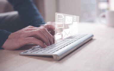 email and document concept, businessman typing on keyboard reviewing reading sending email to...