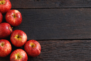 fresh red apples on the wooden floor