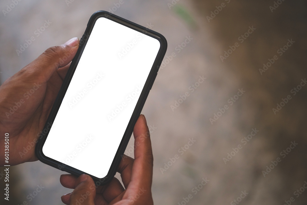 Poster close up view of man holding mock up smart phone with blank screen..