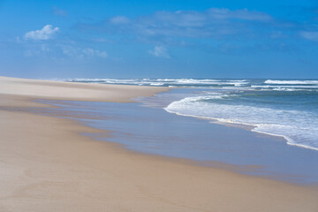 vacation concept, blue ocean on sandy beach