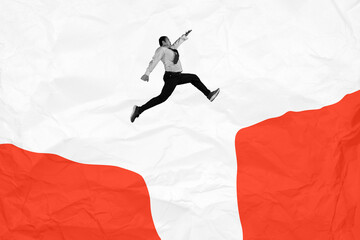Businessman jumping over a cliff