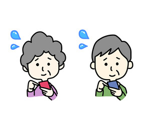 スマートフォンの操作に苦労する高齢者