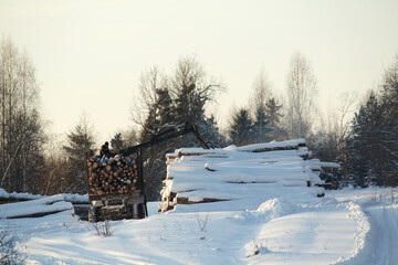 Fototapeta na wymiar Winter logging in a remote village in Russia