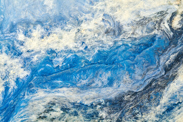 Abstract blue color background. Multicolored fluid art. Waves, splashes and blots acrylic alcohol ink, paints under water