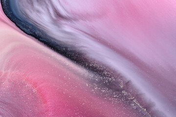 Multicolored creative abstract background. Texture of acrylic paint. Stains and blots of alcohol ink pink blue colors, fluid art.