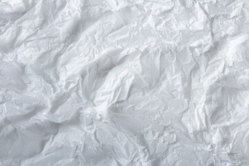 Obraz premium White crumpled paper texture. wavy textured background
