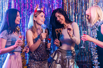 Group of female friends dancing in the club