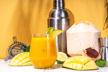 Mango coconut margarita cocktail, Non-alcoholic mocktail, indian mango lassi with fresh young...