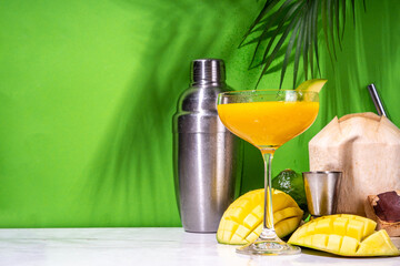 Mango daikiri or martini cocktail, Sweet tropical daiquiri mocktail with fresh coconut water and...