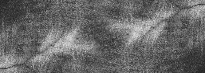 Horizontal design on concrete wall, old loft dark gray cement and black burn concrete wall cracks or cracked floor - exposed wall for pattern and background, vintage exterior decor retro wallpaper
