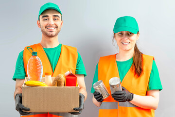 Help Collection Center, free food distribution. Volunteers wearing uniform green caps, t-shirts,...