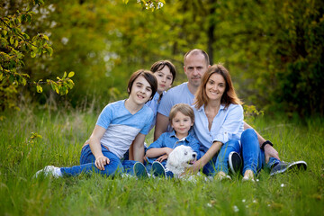 Beautiful family in the park, taking family portrait pictures