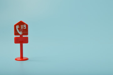 911 sign isolated on a blue background.Emergency call number concept.