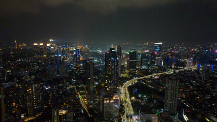 Fototapeta na wymiar Jakarta with skyscrapers and the illumination of the night.