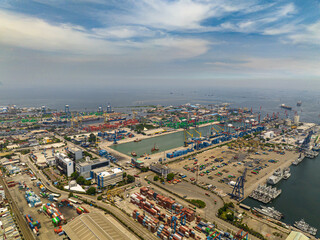 Fototapeta na wymiar Sea cargo port with containers and cranes. Tanjung Priok port. Indonesia.
