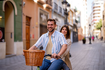 Couple enjoying a bicycle ride in the city