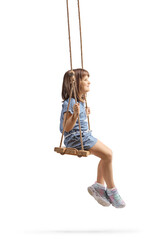 Full length profile shot of a happy little girl sitting on a wooden swing