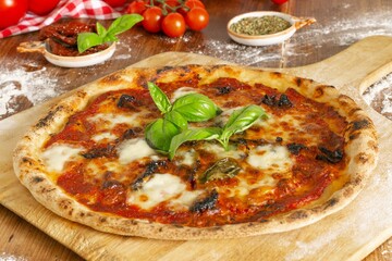 Fresh Homemade Italian Pizza Margherita with dried tomatoes, buffalo mozzarella and basil - 601419229