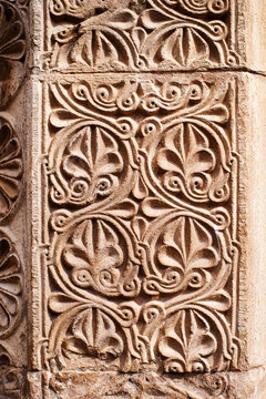 Floral bas-relief on the facade of an ancient temple in Georgia. Architectural decorative element, background