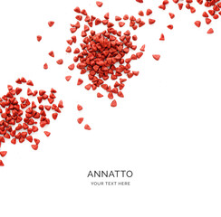 Creative layout made of annatto seeds on white background. Flat lay. Achiote Food Concept. Macro  concept.