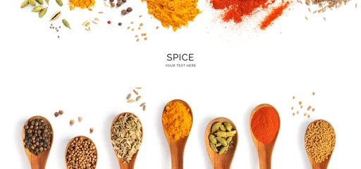  Creative layout made of spices, cardamon, chilli pepper, cumin, curry, coriander, paprika, seeds, anise, black pepper, mustard seeds on the white background. Flat lay. Food concept.  © StudioDFlorez