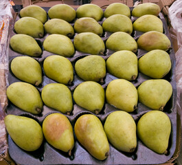 Fresh pears on display at supermarket. 