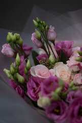 Pink flowers and green plants in a bouquet 