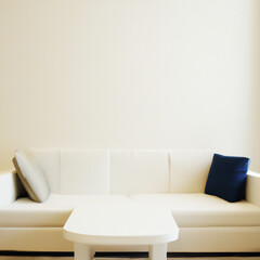 Mock up living sitting room with off off white couch with pillows in front of off white wall open copy space and table on floor. AI Image