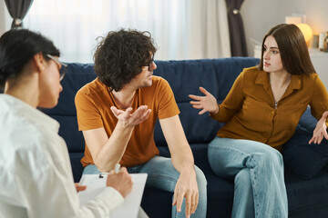 Marital Psychotherapy. Man and woman having conflict and quarrel during therapy session. Marital crisis, marriage counseling concept