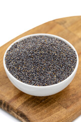 Blue poppy seeds. Spices concept. Blue poppy seeds isolated on white background. Close up