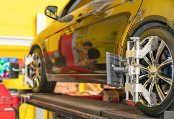 Wheel alignment ,Car on stand with sensors on wheels for wheels alignment camber.